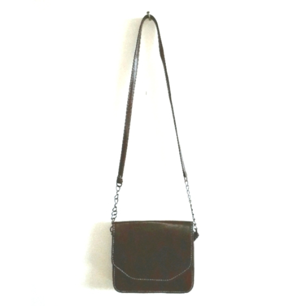 Brown leather purse with white stitching and chains